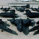 Group photo of 11 SR-71s. The SR-71C is at the back of the arrangement.